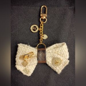 Elegant Cream Bow Keychain with Gold Accents
